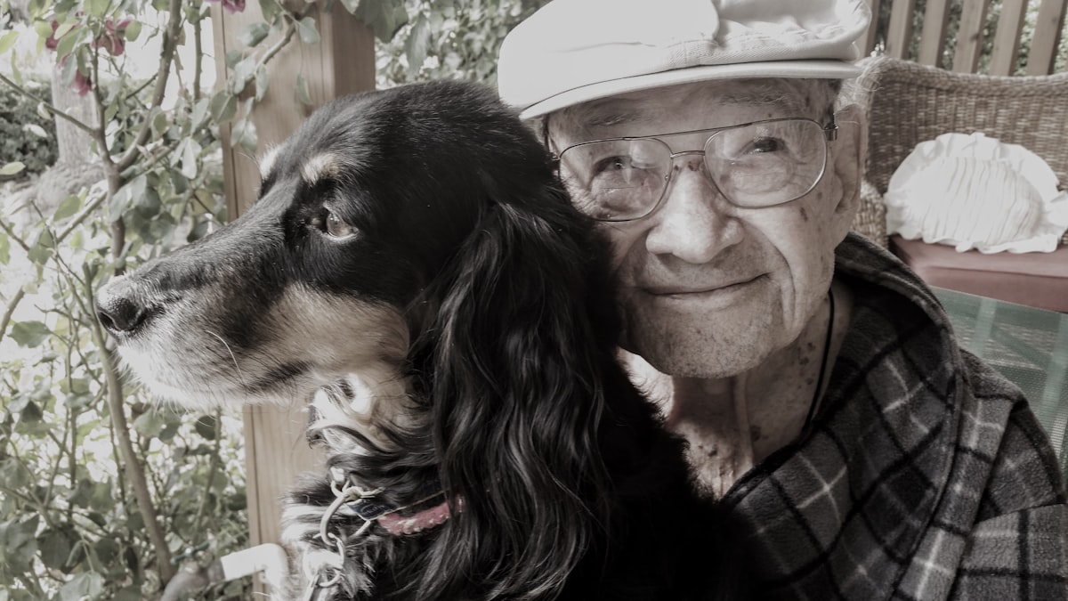 Older adult sharing a calm moment with their pet.